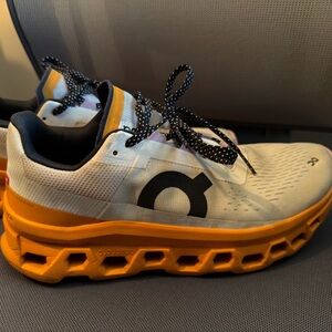 On Running Athletic Shoes in White and Orange